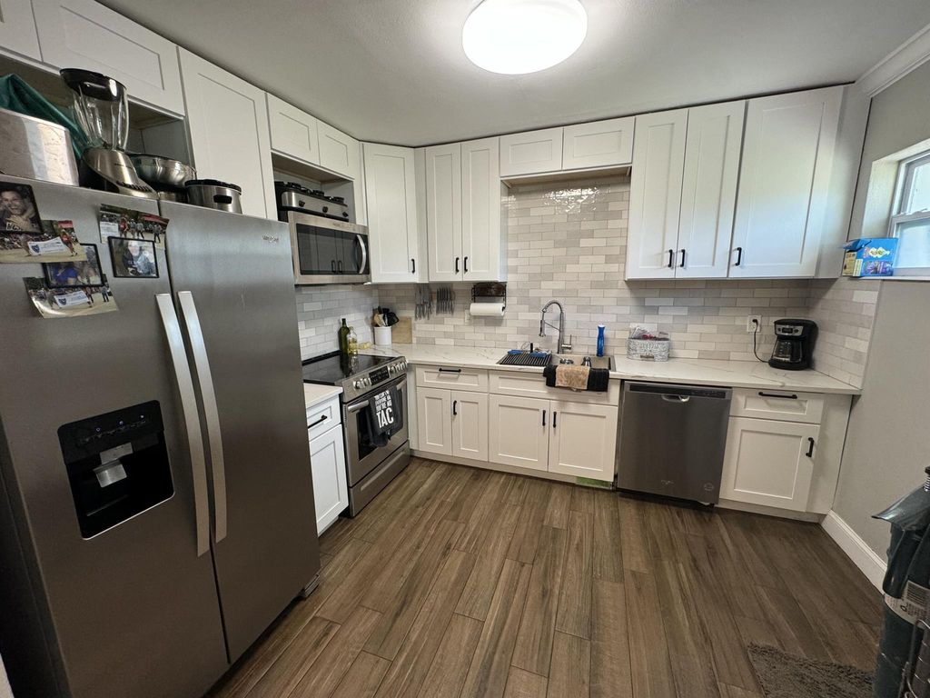 Photo of 459 Silver Beach Road, Lake Park, FL 33403 (MLS # R11000978)