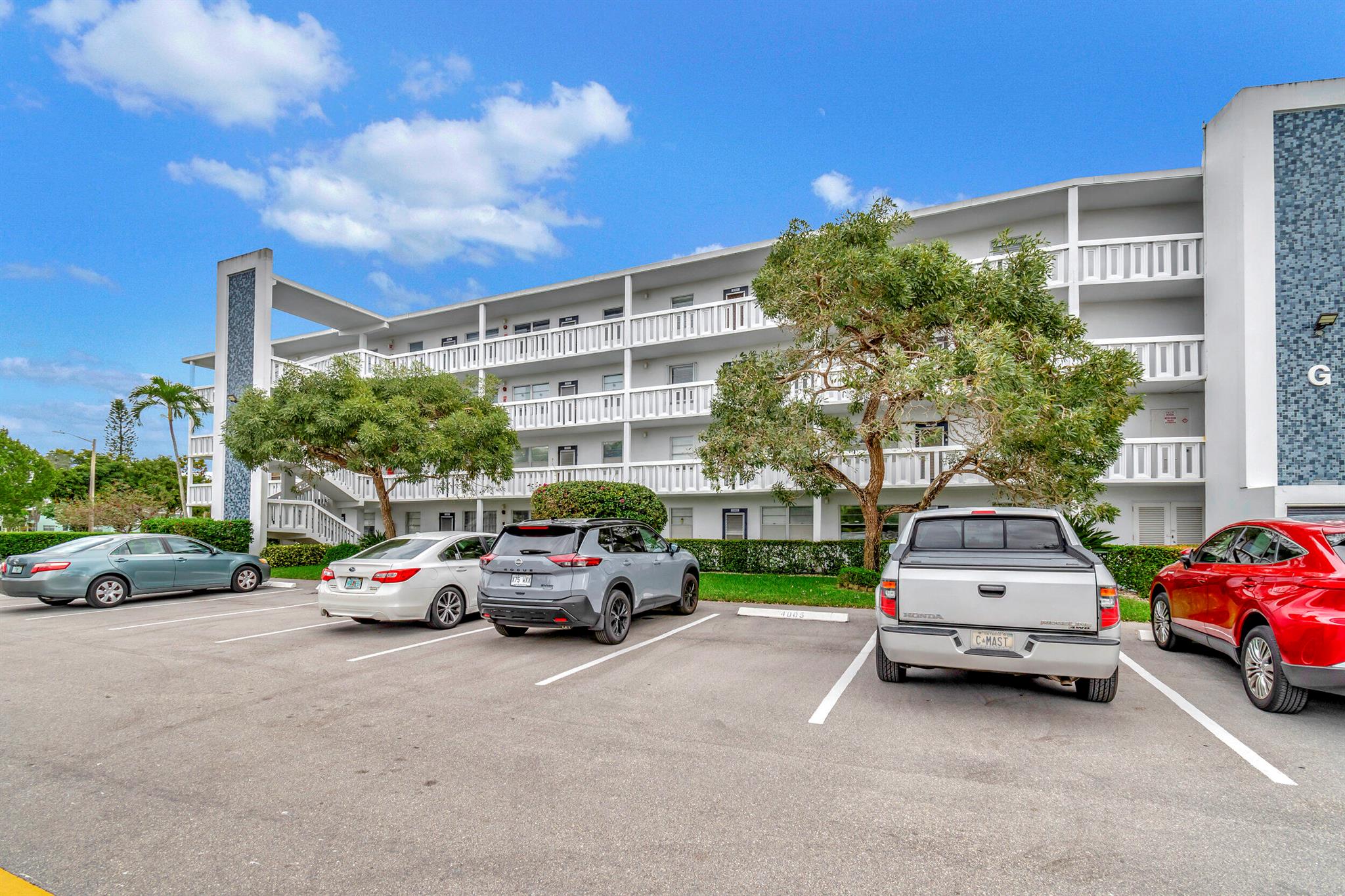 Experience retirement living at its finest in this NEWLY RENOVATED 2BR/2BA condo in the GATED COMMUNITY of Century Village. Located on the 2nd floor, enjoy PANORAMIC LAKE VIEWS from the comfort of the enclosed patio. RECENTLY REMODELED from FLOOR TO CEILING, this condo features an OPEN CONCEPT KITCHEN with WHITE QUARTZ COUNTERTOPS, SUBWAY TILE BACKSPLASH & STAINLESS-STEEL APPLIANCES. The kitchen also boasts WALL-TO-WALL WHITE CABINETRY with a FOUR-DOOR PANTRY, ensuring ample storage space. Step onto the NEW WATERPROOF VINYL FLOORING THROUGHOUT or freshen up in the MODERNIZED BATHROOMS that have been tastefully appointed with NEW VANITIES, TOILETS, TOUCH BUTTON MIRRORS & STANDUP SHOWERS. Say GOODBYE TO OUTDATED POPCORN CEILINGS, as RECESSED LIGHTING ILLUMINATES THE ENTIRE SPACE.