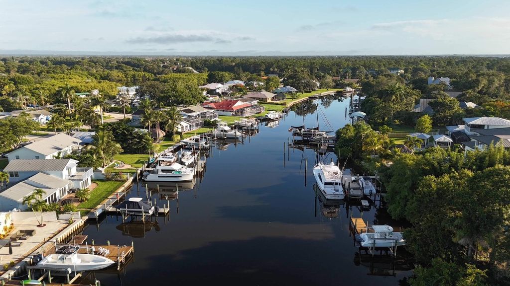 Photo of 691 SW Pine Tree Lane, Palm City, FL 34990 (MLS # R11090541)