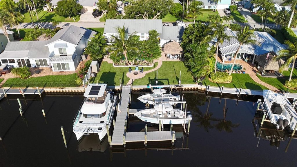 Photo of 691 SW Pine Tree Lane, Palm City, FL 34990 (MLS # R11090541)