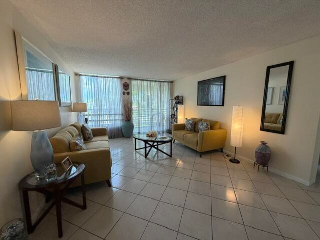 Photo of 8050 W Mcnab Road #203, Tamarac, FL 33321 (MLS # B26043080)