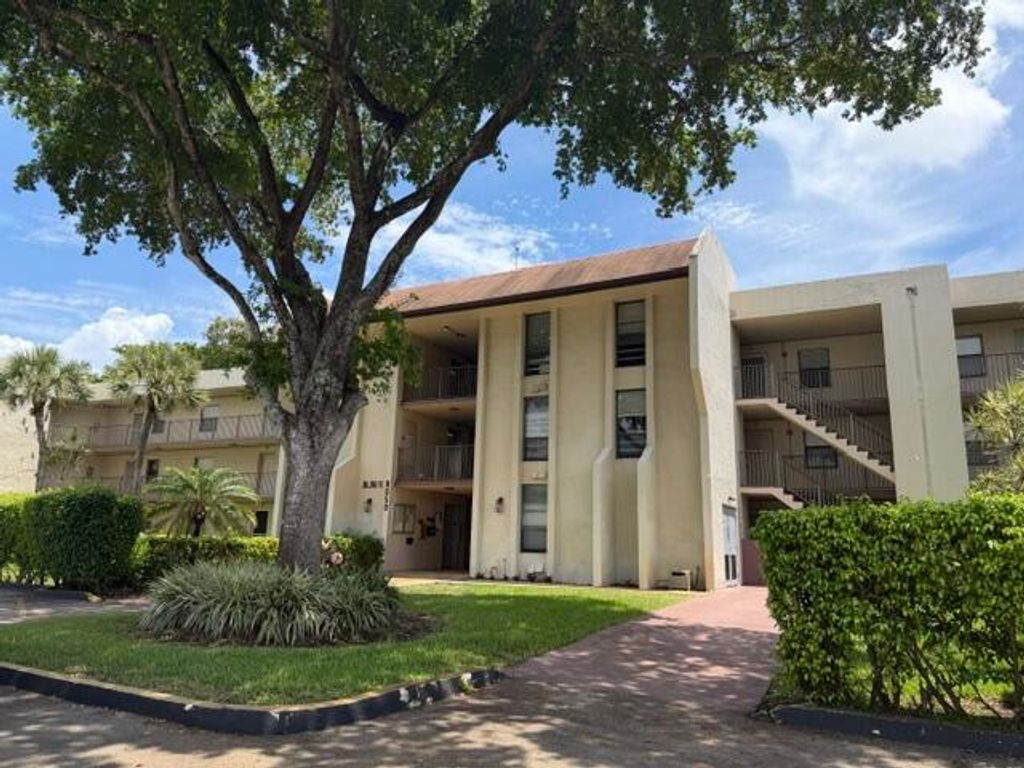 Photo of 8050 W Mcnab Road #203, Tamarac, FL 33321 (MLS # B26043080)