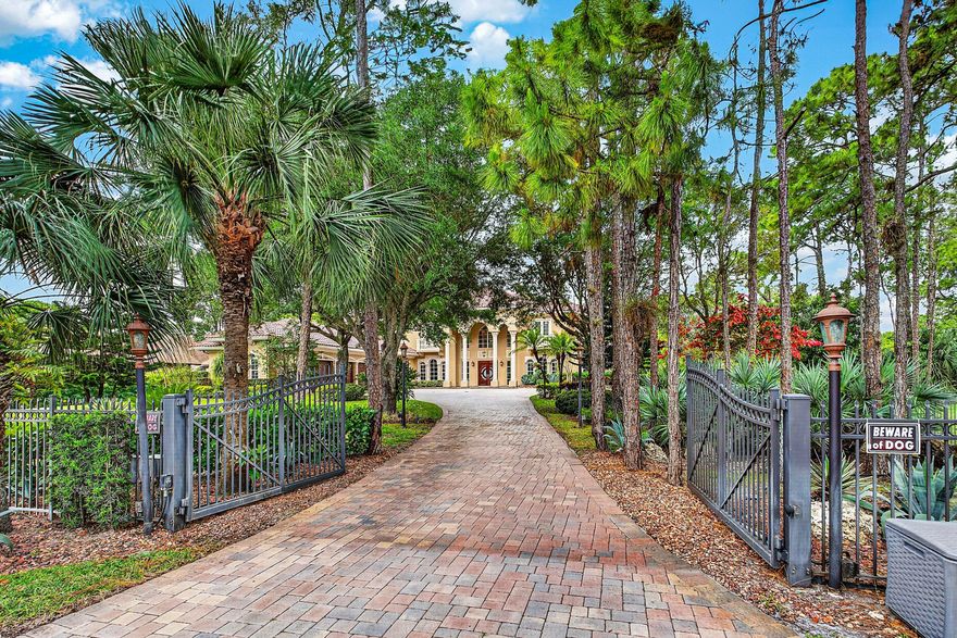 Experience the pinnacle of luxury living at 6071 NW 69th Way in Parkland's coveted Pine Tree Estates. Set on a private, lushly landscaped 1-acre lot, this extraordinary estate redefines elegance and comfort. Step through the gates into your own serene sanctuary, complete with an oversized pool, a spacious 4-car garage, and an attached in-law suite featuring a full kitchenette & accessibility features—perfect for multi-generational living or hosting guests in style. The first-floor master suite offers a seamless blend of sophistication and accessibility, while the chef's kitchen is a culinary masterpiece outfitted with a full-size Subzero fridge and freezer, dual prep islands, and even an outdoor kitchen featuring a wood-fired pizza oven.  Entertaining is a breeze here, with a billiard/game room and a screened-in lanai ideal for gatherings of any size. Take the festivities outdoors to the pool house or simply unwind in complete tranquility. And with the added peace of mind of a full-house generator, this estate ensures comfort no matter the season. This is more than a home—it's a lifestyle. Located in one of Parkland's most prestigious neighborhoods, this property offers the perfect mix of privacy, luxury, and convenience. Schedule your private tour today to truly appreciate all this exceptional estate has to offer.