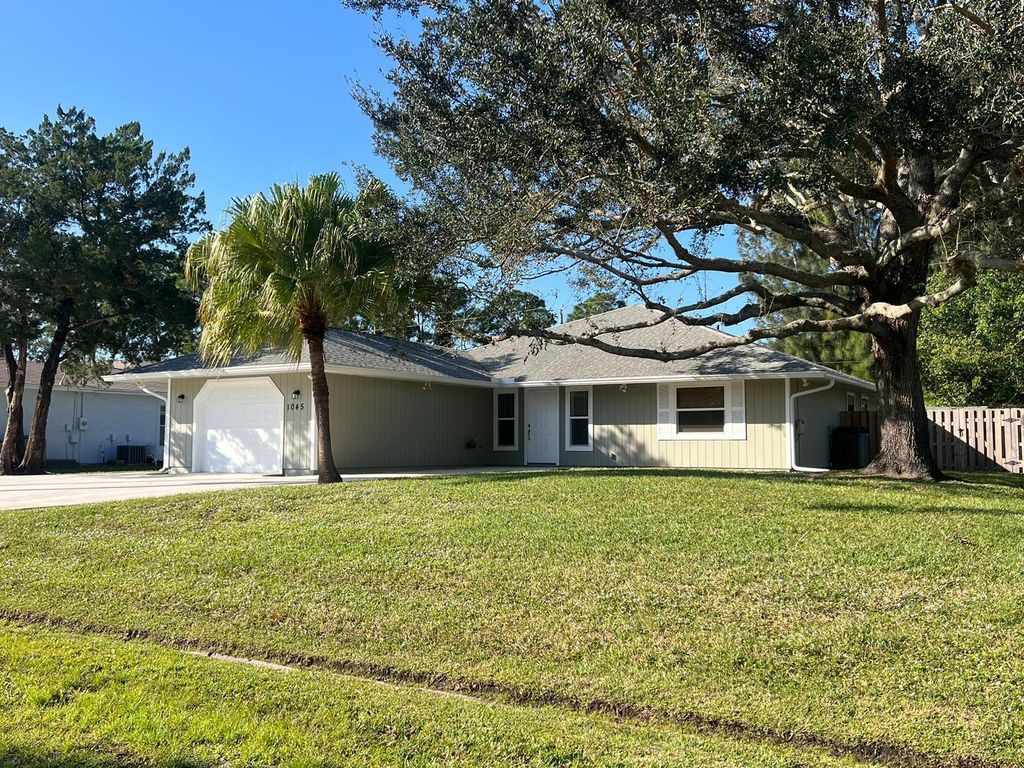 Photo of 1045 SW Bay State Road, Port Saint Lucie, FL 34953 (MLS # R11104083)