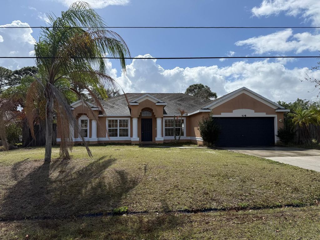 Photo of 974 SW California Boulevard, Port Saint Lucie, FL 34953 (MLS # B26022887)