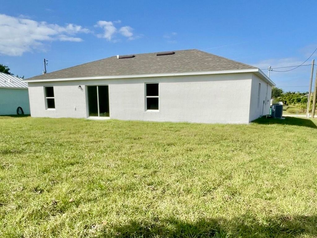 Photo of 4111 SW Baltic Street, Port Saint Lucie, FL 34953 (MLS # B26019228)