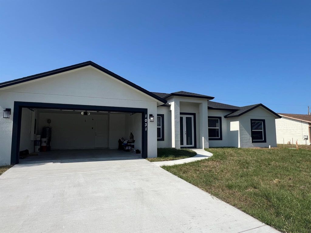 Photo of 1031 SW Du Bois Avenue, Port Saint Lucie, FL 34953 (MLS # R10986610)