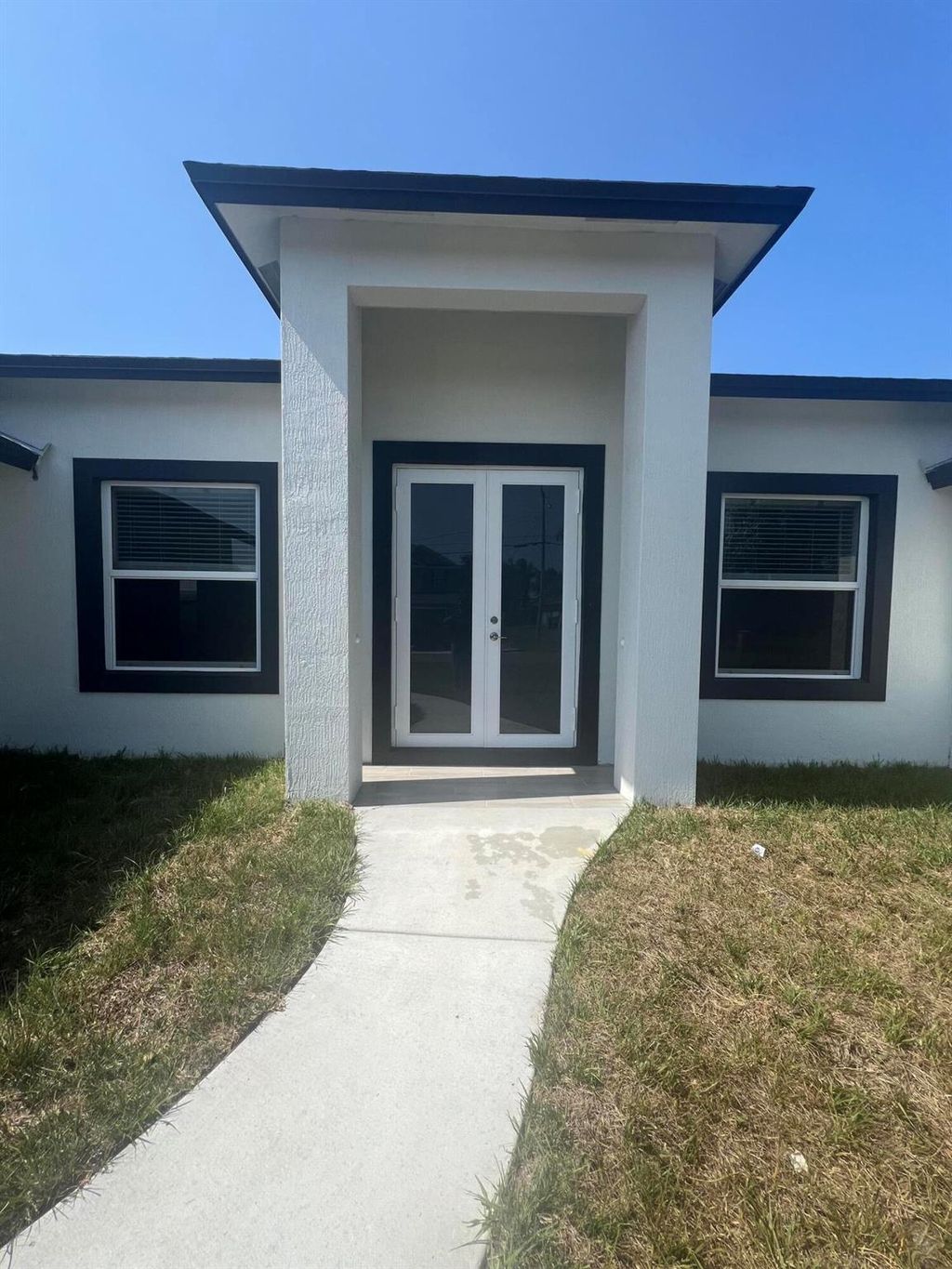 Photo of 1031 SW Du Bois Avenue, Port Saint Lucie, FL 34953 (MLS # R10986610)