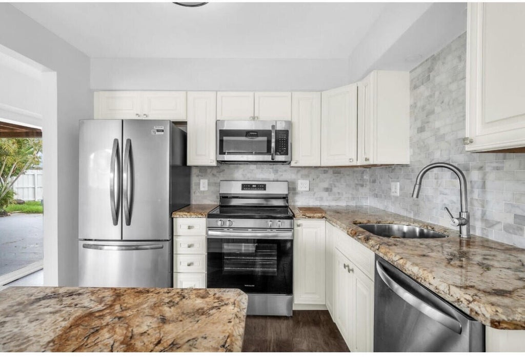 Photo of 1740 NE 64th Street, Fort Lauderdale, FL 33334 (MLS # B26041122)