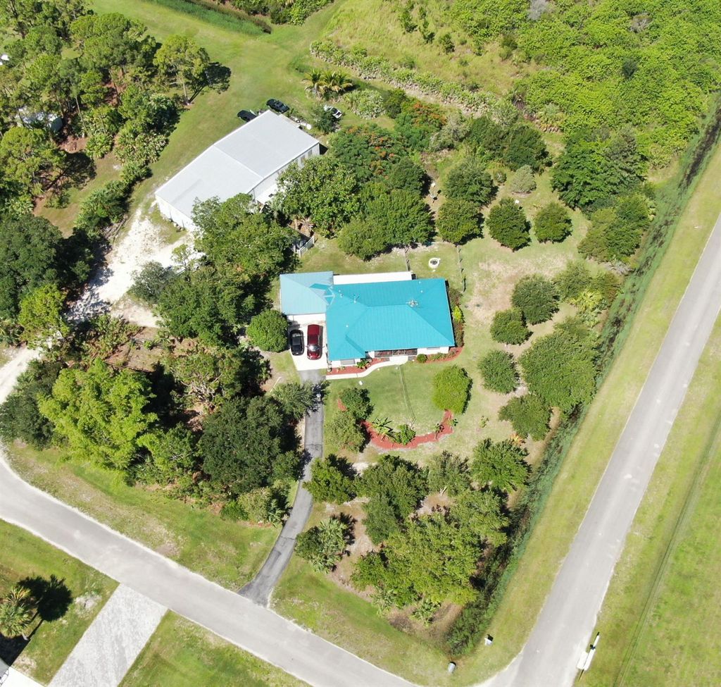 Photo of 12451 Piper Cub Ter, Port Saint Lucie, FL 34987 (MLS # R10972297)