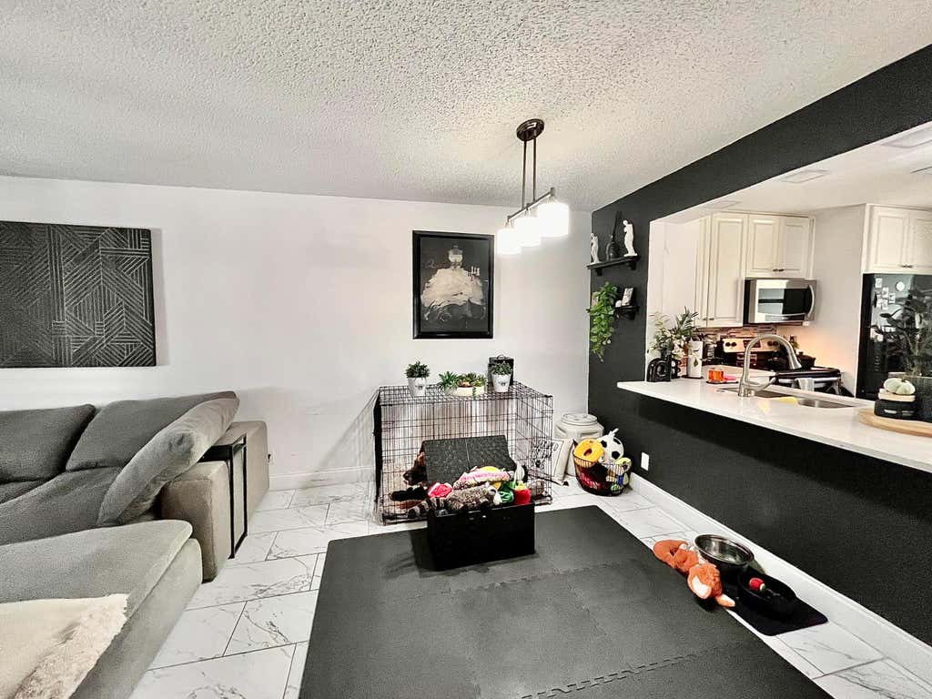 Photo of 8301 SANDS POINT Boulevard #S306, Tamarac, FL 33321 (MLS # B26060886)