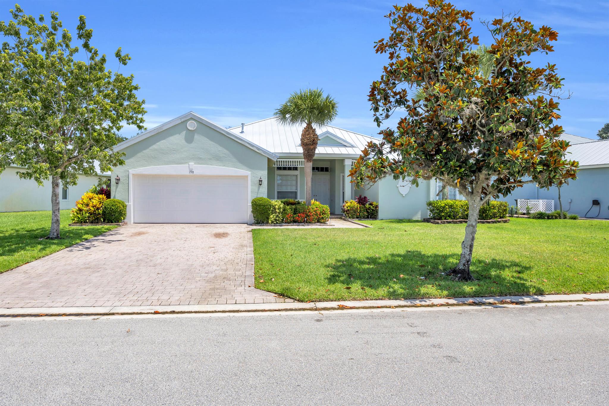Welcome to this beautifully updated home with a flexible office space--perfect for working from home. Located in a quiet, desirable neighborhood of Port St. Lucie, this property combines comfort, convenience, and peace of mind with a brand-new metal roof built to last for decades.Inside, you'll find a bright and open living area with vaulted ceilings and plenty of natural light. The kitchen features modern appliances, ample cabinetry. The spacious primary suite private bath with dual vanities, a soaking tub, and a separate shower. Step outside to enjoy a screened-in patio overlooking the private, fully fenced backyard. Conveniently located near I-95, top-rated schools, shopping, dining, and the beaches! Schedule your showing today--homes with upgrades like this one don't last long!