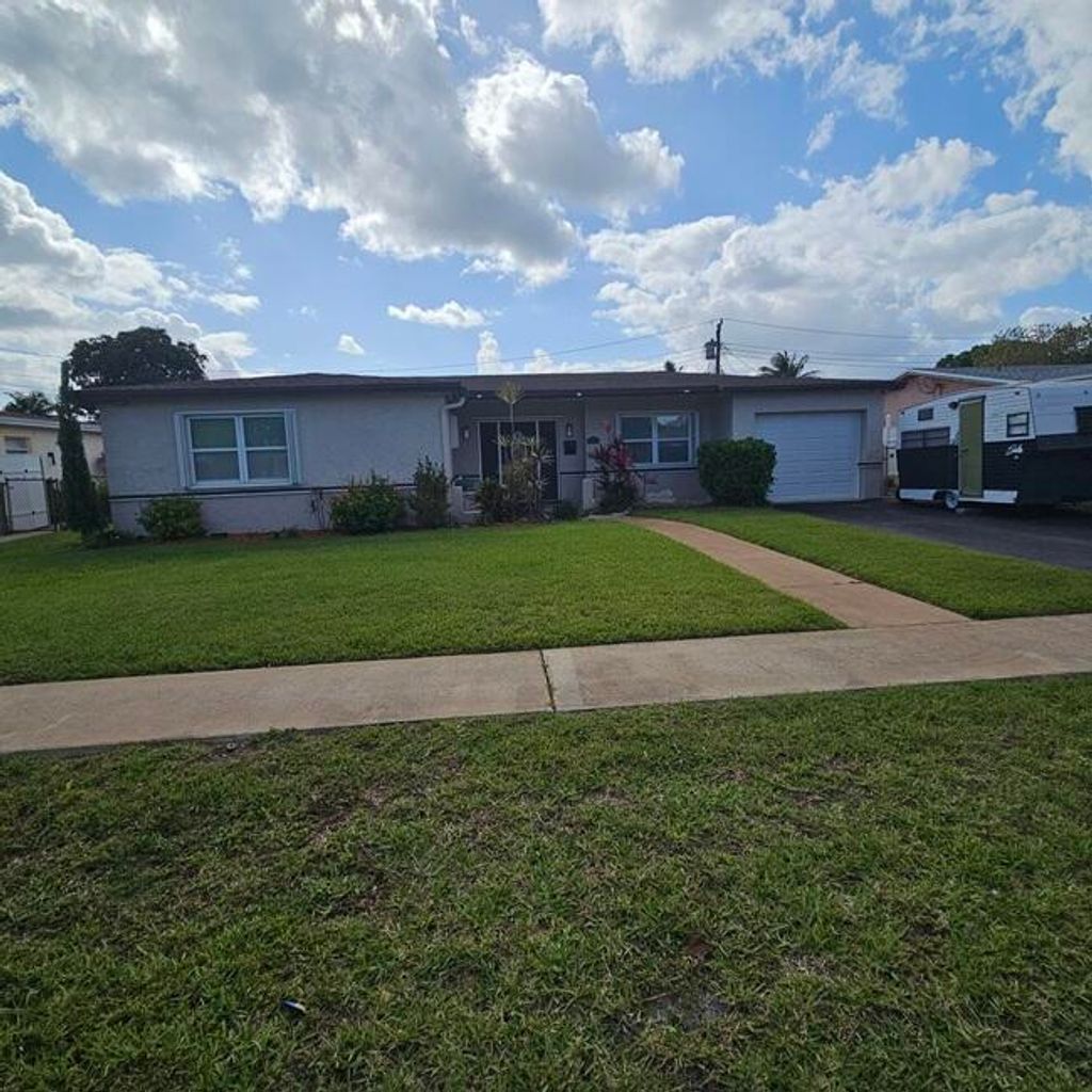 Photo of 4325 NW 36th Way, Lauderdale Lakes, FL 33309 (MLS # B26011369)