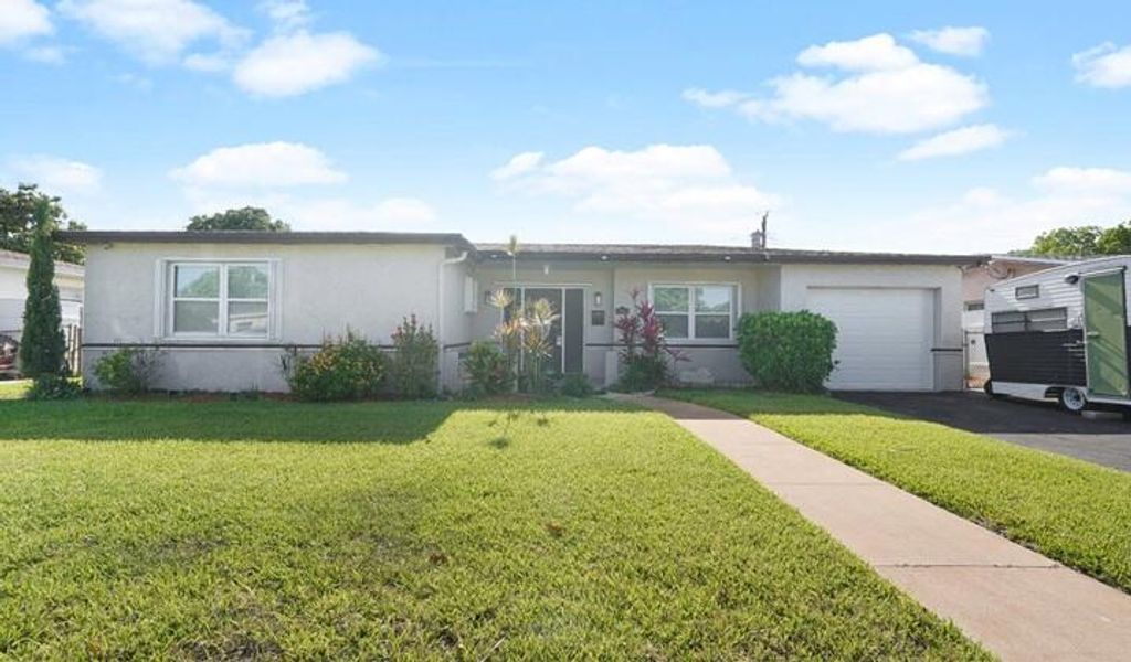 Photo of 4325 NW 36th Way, Lauderdale Lakes, FL 33309 (MLS # B26011369)