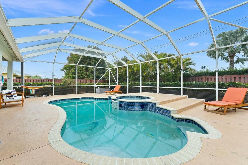 Photo of 833 SW Janette Avenue, Port Saint Lucie, FL 34953 (MLS # R11066250)