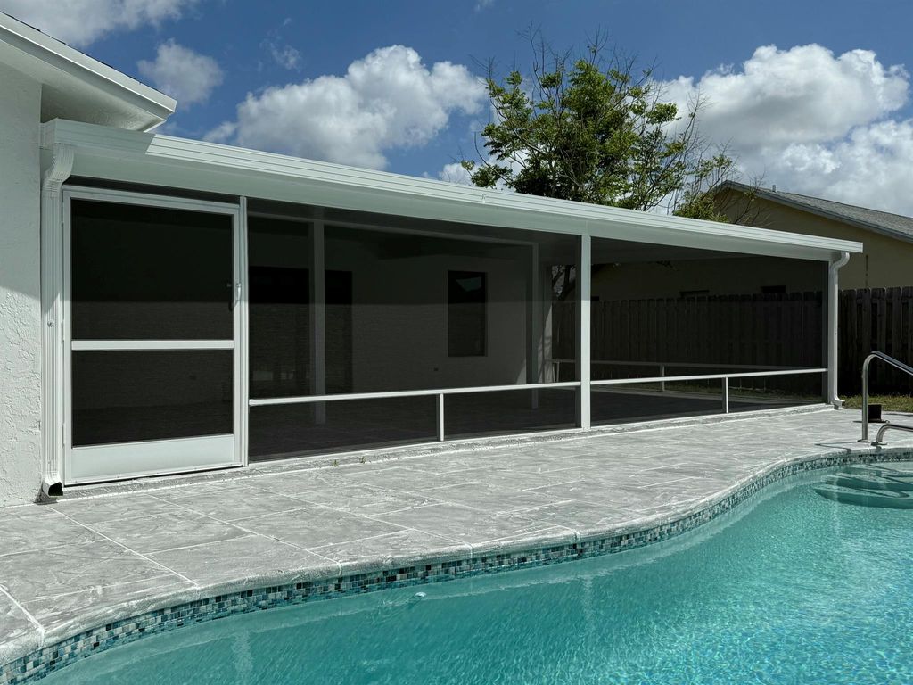 Photo of 102 Santa Monica Avenue, Royal Palm Beach, FL 33411 (MLS # R11084507)