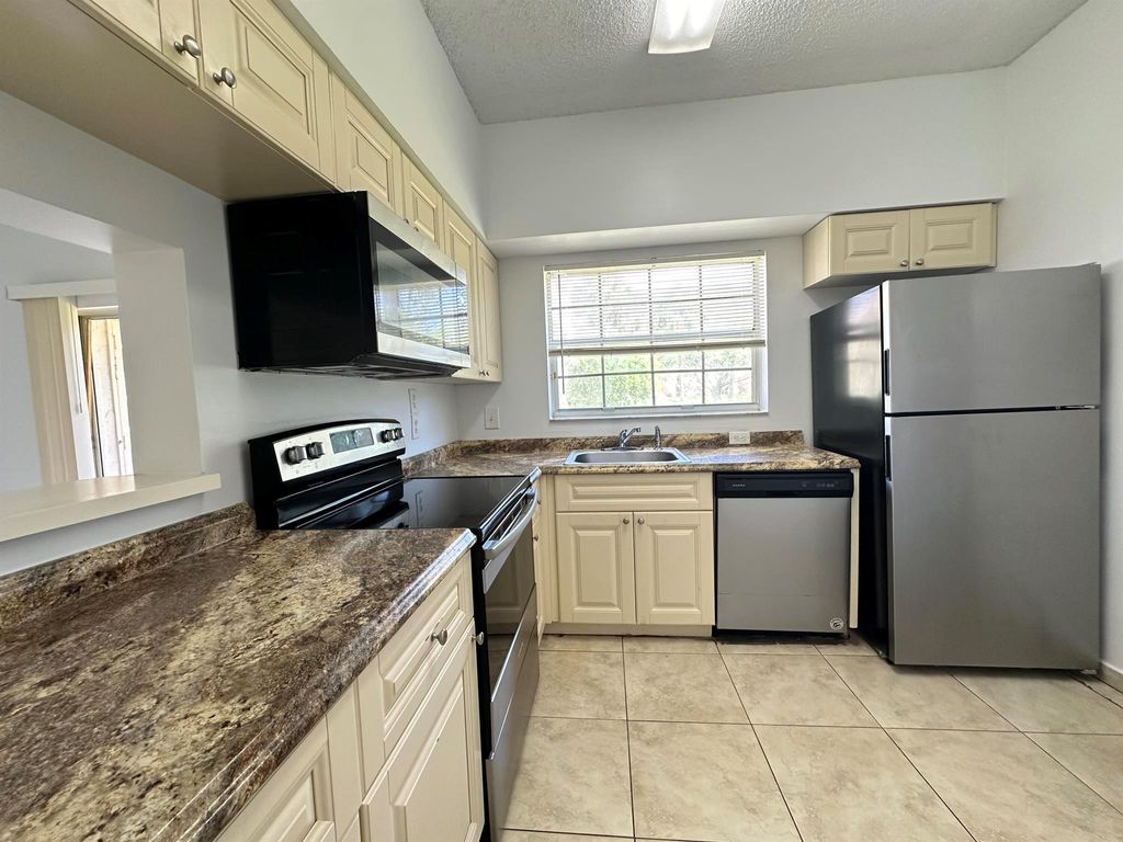 Photo of 891 Cypress Park Way #I, Deerfield Beach, FL 33064 (MLS # R11091818)