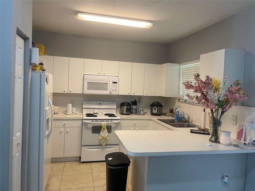 1st floor unit now available in gated community of Caribbean Isles! Gorgeous unit and property! Spacious, perfect for a family. Washer and dryer in the unit, plenty of parking. As a resident, enjoy all the amenities of the clubhouse.
