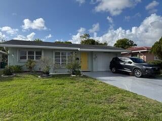 Photo of 4919 NW 47th Terrace, Tamarac, FL 33319 (MLS # B26081917)