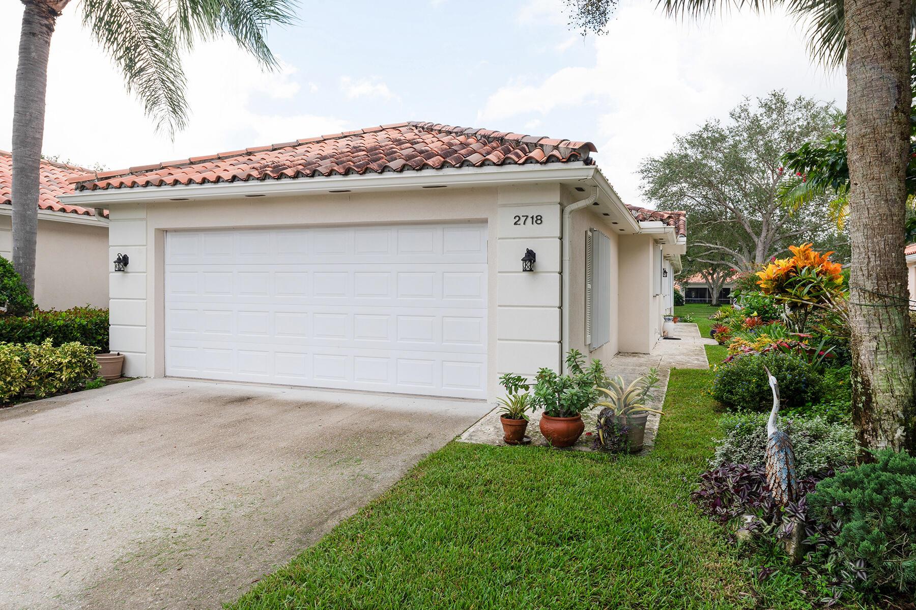 A Wide, Tropically Landscaped, Lakeside, Lot with Views of the Azure Blue Lake, is Just One of the Attributes that makes this Capri, Truly Unique! In RiverWalk, A 24 Hour Manned Gated Community in One of the Best Locations in Palm Beach County, 15-20 minutes to Everything including Palm Beach, the Ocean & Airport! This is Only the Beginning! The Lush & Inviting Entry Courtyard leads to the Foyer with a Charming Fixture & a Gleaming White Ceramic Tile Floor, that Opens to the Great Room with a Newer Faux Bleached Wood Floor & a Newer Ceiling Fan! The Ceramic Tile Kitchen, the Hub for Everyday Living & Casual Entertaining has Stunning Quartz Countertops, Ceramic Tile Backsplashes, All of the Appliances including a Newer Frigidaire Refrigerator, GE Ceramic Top Range, Dishwasher & Microwave