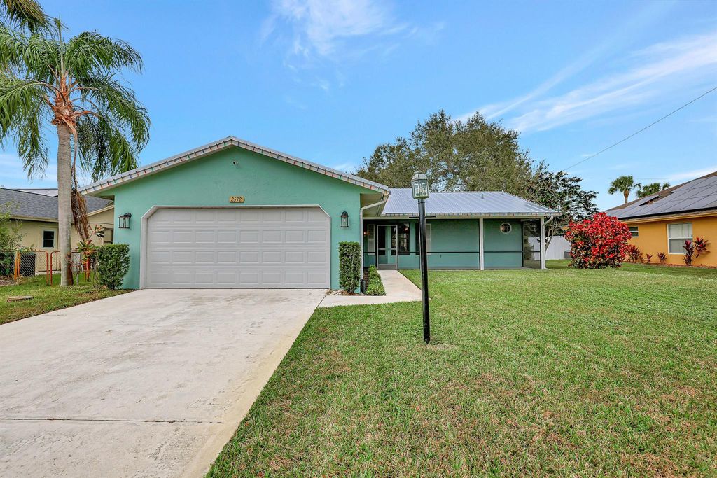 Photo of 2572 SW Mcdonald Street, Port Saint Lucie, FL 34953 (MLS # R10943729)