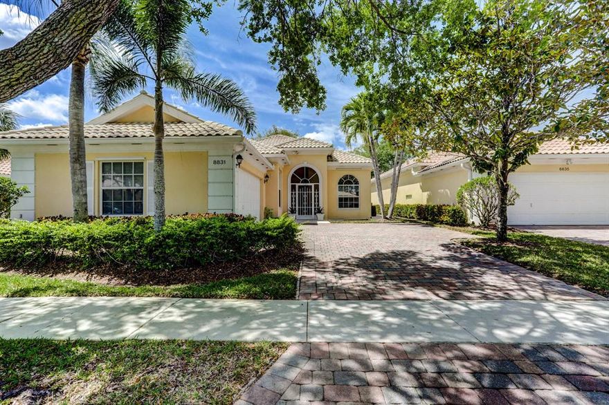 Beautiful Popular Oakmont model of DiVosta home series in gated community of Carleton Oaks near Palm Beach National Golf Course. Screened entrance vestibule opens to large foyer flowing into open living space floor plan with  two 3-section sliding doors which fully open to extend living area into screened lanai looking into a private backyard. The great room has full wall entertainment center with white cabinets and mirrored shelves climbing to cathedral ceiling. Large Corian kitchen counter for everyday eating off living area with separate sliding door and patio.  Three spacious bedrooms and 3 full baths with a separate private office featuring Palladium windows and built in's from floor to ceiling.