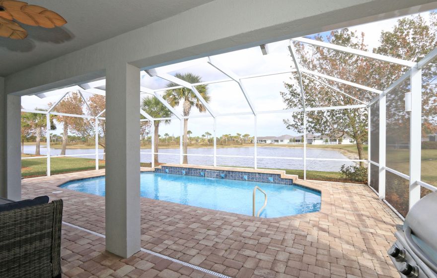 Gorgeous wide lakefront views highlight this extended Summerwood model. This spacious three-bedroom, two-bath home features full impact windows and doors, tile flooring throughout, and an open-concept design ideal for comfortable living and entertaining. The chef's kitchen offers a large island, quartz countertops, and ample workspace for gatherings.


The owner's suite includes a generously sized bedroom, a custom-organized walk-in closet, and a luxurious bath with an oversized walk-in shower. Step outside to your screened pool lanai, complete with a summer kitchen, and relax while enjoying peaceful lakefront sunrises and serene water views. Active 55+ lifestyle with 2 clubhouses and pools, pickleball, tennis, putting green and bocce.