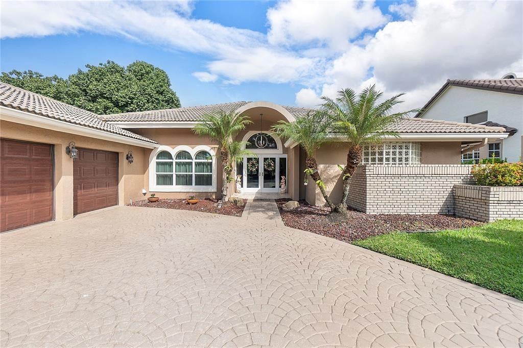 Photo of 11999 Classic Drive, Coral Springs, FL 33071 (MLS # B26040062)