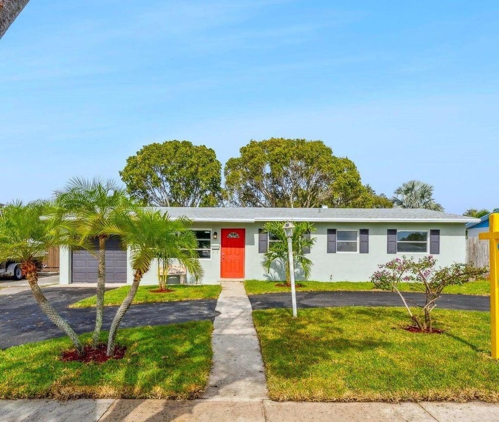 Photo of 815 W Jasmine Drive, Lake Park, FL 33403 (MLS # R10966186)