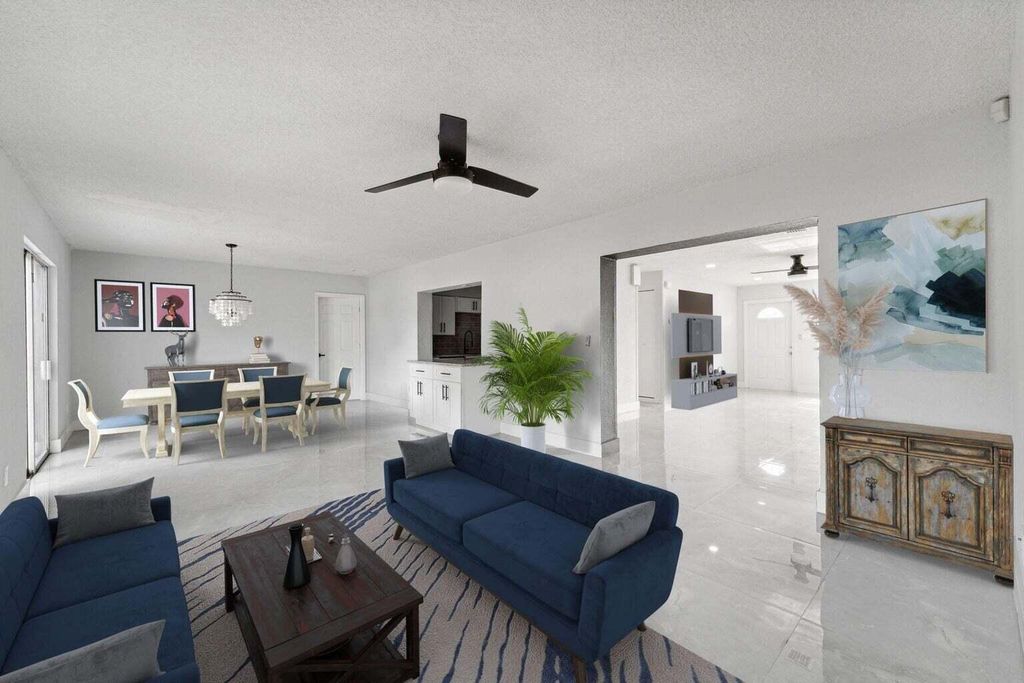 Photo of 815 W Jasmine Drive, Lake Park, FL 33403 (MLS # R10966186)