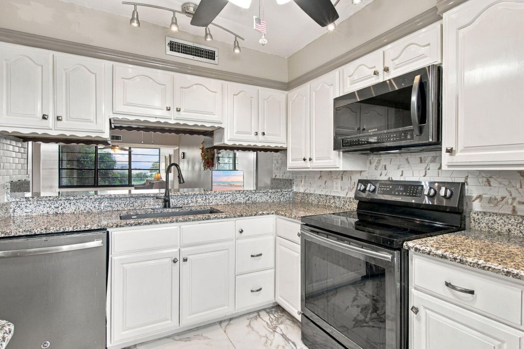 Photo of 1502 WHITEHALL Drive #305, Davie, FL 33324 (MLS # B26083287)