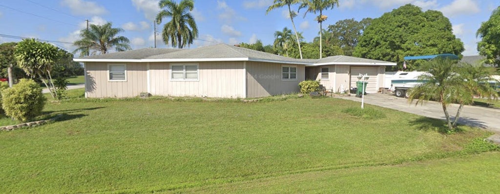 Photo of 1525 SE HOLIDAY Road, Port Saint Lucie, FL 34952 (MLS # B26078465)