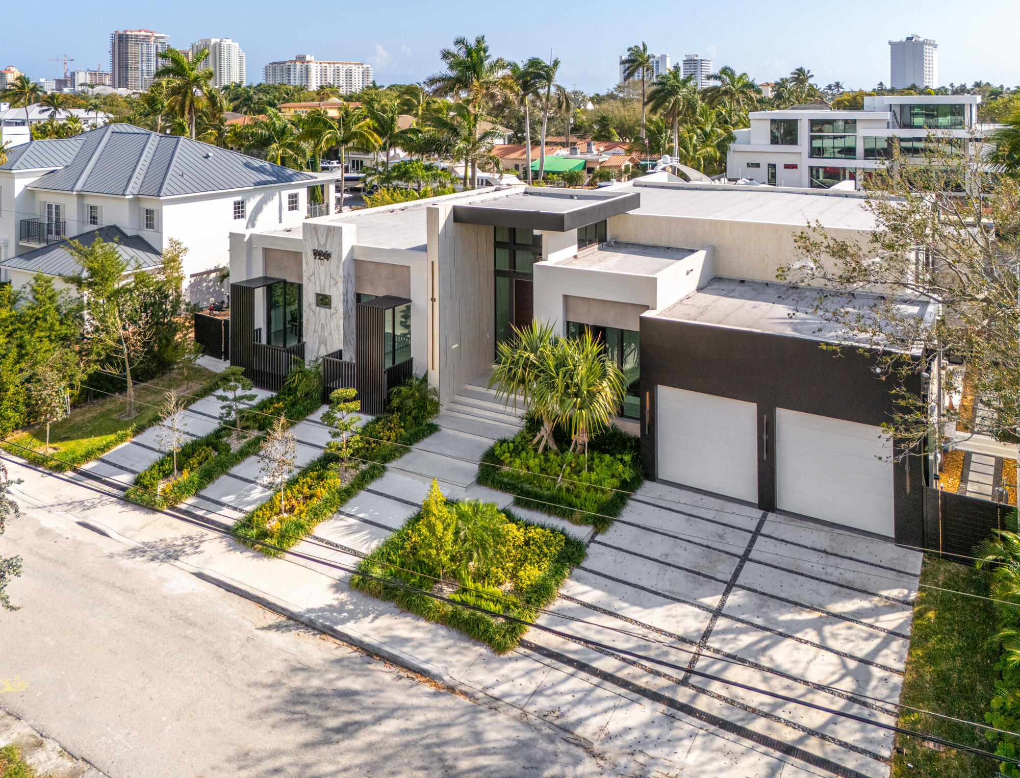 Experience unparalleled waterfront luxury living in the sought-after Riviera Isles community of Fort Lauderdale, just moments from the vibrant Las Olas Boulevard. This modern masterpiece boasts 100 feet of prime waterfront, offering deep water dockage and ocean access ideal for yacht owners. Newly constructed, the home epitomizes sophistication with its minimalist design and cutting-edge smart home technology.Step inside to discover a world of elegance, where designer finishes and panoramic water views create an atmosphere of opulence. Entertain effortlessly in the gourmet kitchen and spacious living areas, or retreat to the privacy of the tranquil master suite. The outdoor oasis features a sparkling pool overlooking the serene waters, perfect for enjoying the Florida sunshine