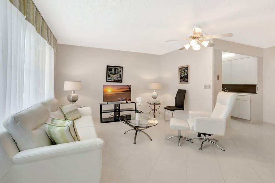 Light, Bright & Beautiful! Welcome to this spacious and stylish 1 bed, 1.5 bath condo in South Florida's premier 55+ community - Century Village Deerfield Beach! Ideally situated on the 2nd floor just steps from the clubhouse, this unit puts all the resort-style amenities practically at your doorstep. Step inside to an open-concept living and dining area, complete with modern, comfortable furniture (included!), and gleaming tile floors throughout - no carpet here! The updated half-bath is perfect for guests, while the generous primary suite easily fits a king-sized bed, boasts abundant closet space, and features a fully remodeled en suite bath with a sleek walk-in shower - no tub! Enjoy your morning coffee, unwind with a good book, or host a happy hour with friends in the Florida sunshine This unit checks all the boxes: move-in ready, low-maintenance, and full of natural light. Come enjoy the Century Village lifestyle with endless amenities, activities, and a vibrant community!