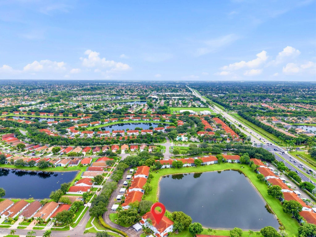 Photo of 7881 WHISPERING PALMS Drive #202, Boynton Beach, FL 33437 (MLS # B26074804)