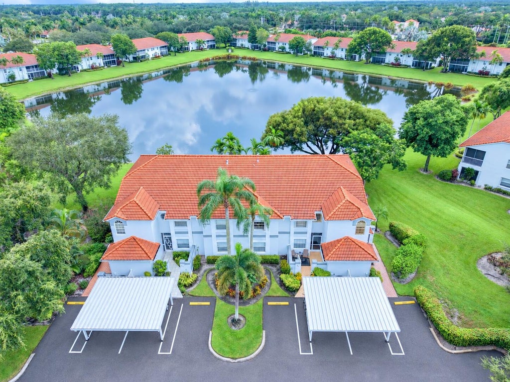 Photo of 7881 WHISPERING PALMS Drive #202, Boynton Beach, FL 33437 (MLS # B26074804)