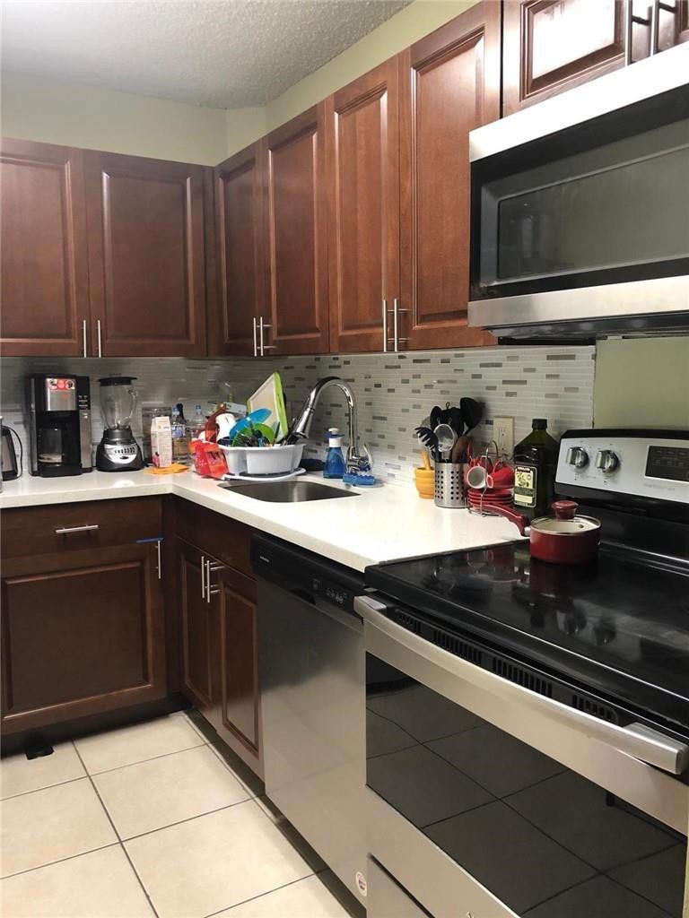 Photo of 10773 Cleary Boulevard #109, Plantation, FL 33324 (MLS # B26041064)