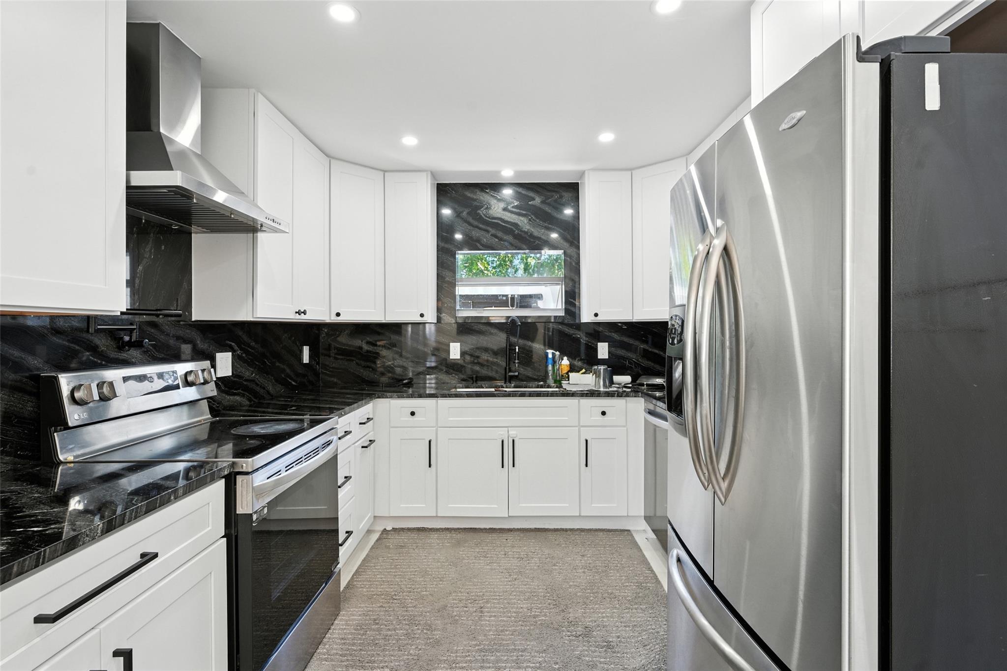 Fully Renovated 4 Bedrooms, 2 Bathroom. On Large corner Lot. Home Features a (2024) Metal Roof, Hurricane Impact windows and Doors. Stunning Modern Kitchen with Stainless Steel Appliances, Updates Baths, new Electrical Panel, New A/C and Water Heater (2024), Backyard Customized with outdoor Kitchen for Relaxing and entertaining. It is located in a quite neighborhood, 5 minutes from Deerfield Beach, close to I-95. YOU MUST SEE IT.