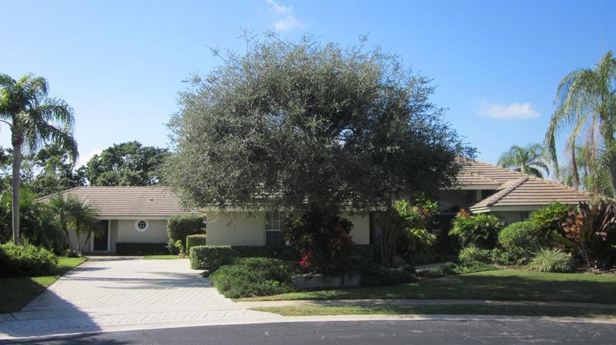 House with guest house/in-law unit.  Significantly reduced by $30K!!!  Located at the very end of a cul-de-sac in the manned, gated community of Polo West Estates.  Expansive backyard exposure to golf course/greenspace separated by canal which leads to lake and parks.  Absolutely magnificent sunsets from your backyard.  Main house features open/split floor plan with 4 bedrooms/3-1/2 baths, 3 car garage.  Guest cottage is large 1 bedroom/1 bath with standard size sauna off of the bathroom.  Roof throughout was redone in '07 when addition was added.  Irrigation draws from canal.  Commercial gas range (Garland), custom cedar wainscoating in main house living area, custom teak wall unit (signed by artist) to remain with house.  Well run HOA.  Come view this home and make it your own!