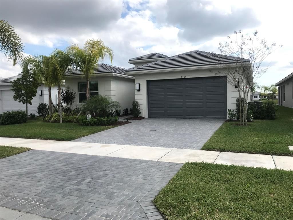 Photo of 11784 SW Sailfish Isles Way, Port Saint Lucie, FL 34987 (MLS # R10776797)