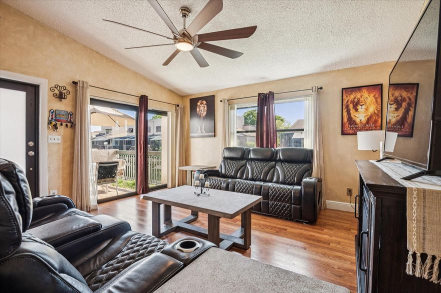 Beautifully updated 2 bed, 2 bath end-unit townhome located on the canal in a guard-gated community. This home offers a convenient layout with one bedroom and full bath on the ground floor, plus a renovated kitchen, modernized bathrooms and water softener system. The spacious interior includes a full-size washer and dryer, and peace of mind knowing the polybutylene pipes have been replaced, and complete hurricane windows & doors. Enjoy the convenience of two assigned parking spaces directly in front of the unit, with guest parking just across the street.
 Community amenities include 2 heated pools, tennis and pickleball courts, racquetball court, and a well-equipped fitness center with both free weights and machines. Security is top-notch with a 24-hour manned guard gate and roving patrol