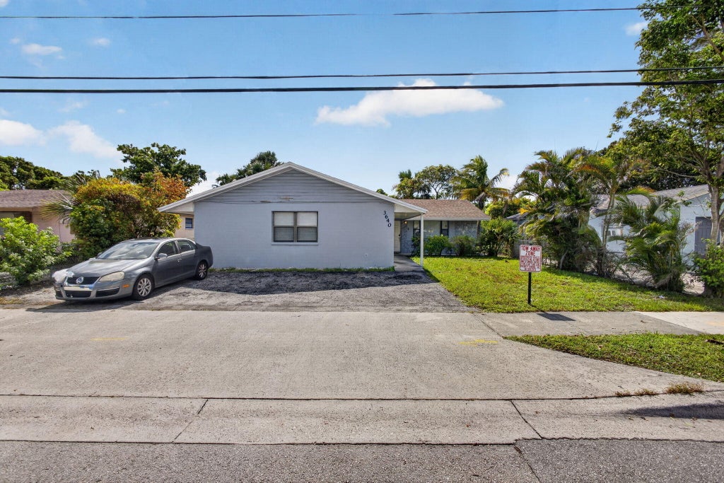 Photo of 3640 Avenue J, West Palm Beach, FL 33404 (MLS # B26057919)