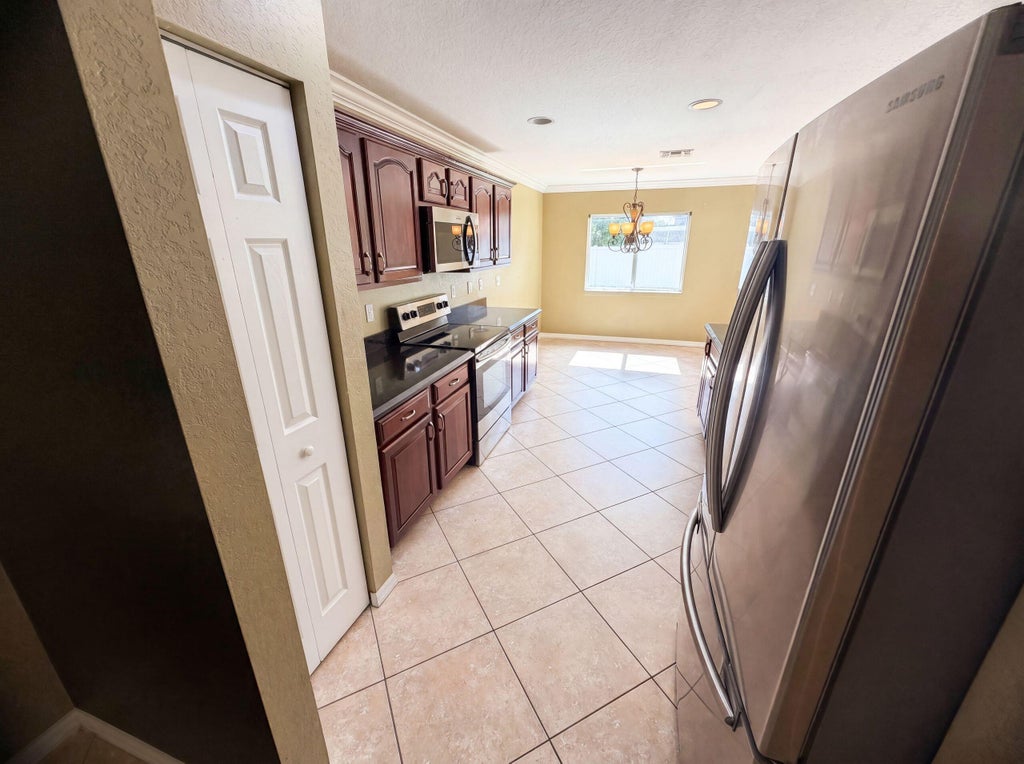 Photo of 2883 SW Cape Breton Drive, Port Saint Lucie, FL 34953 (MLS # B26066150)