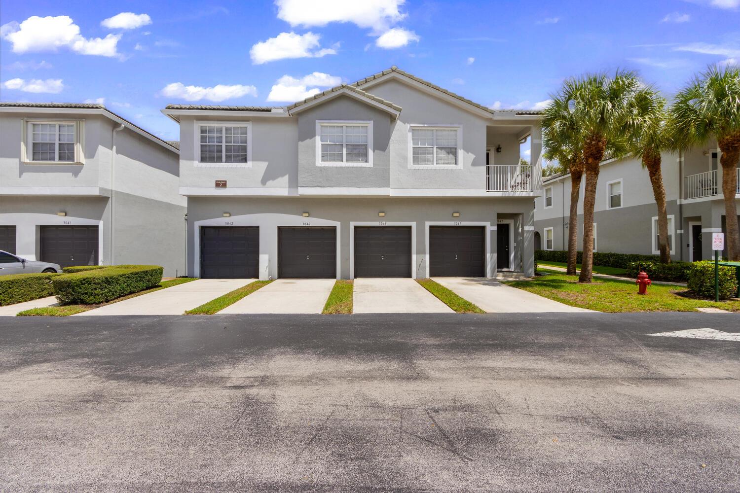 Welcome to Magnolia Bay! This beautifully maintained first-floor condo offers the perfect blend of comfort, convenience, and community living. Featuring 3 spacious bedrooms, 2 fully renovated baths, and over 1,400 sq. ft. of living space, this home is designed with a smart split-bedroom layout for added privacy.Step inside to find tile flooring throughout, a bright and open living area, and a well-appointed kitchen complete with a breakfast bar and modern appliances. Enjoy the convenience of Impact Windows ,doors and Garage for piece of mind .Plantation shutters throughout gives this home that tropical feel with your brand new AC unit .Relax on your screened-in patio with garden views, or take advantage of the attached one-car garage plus guest parking. Magnolia Bay is a gated community