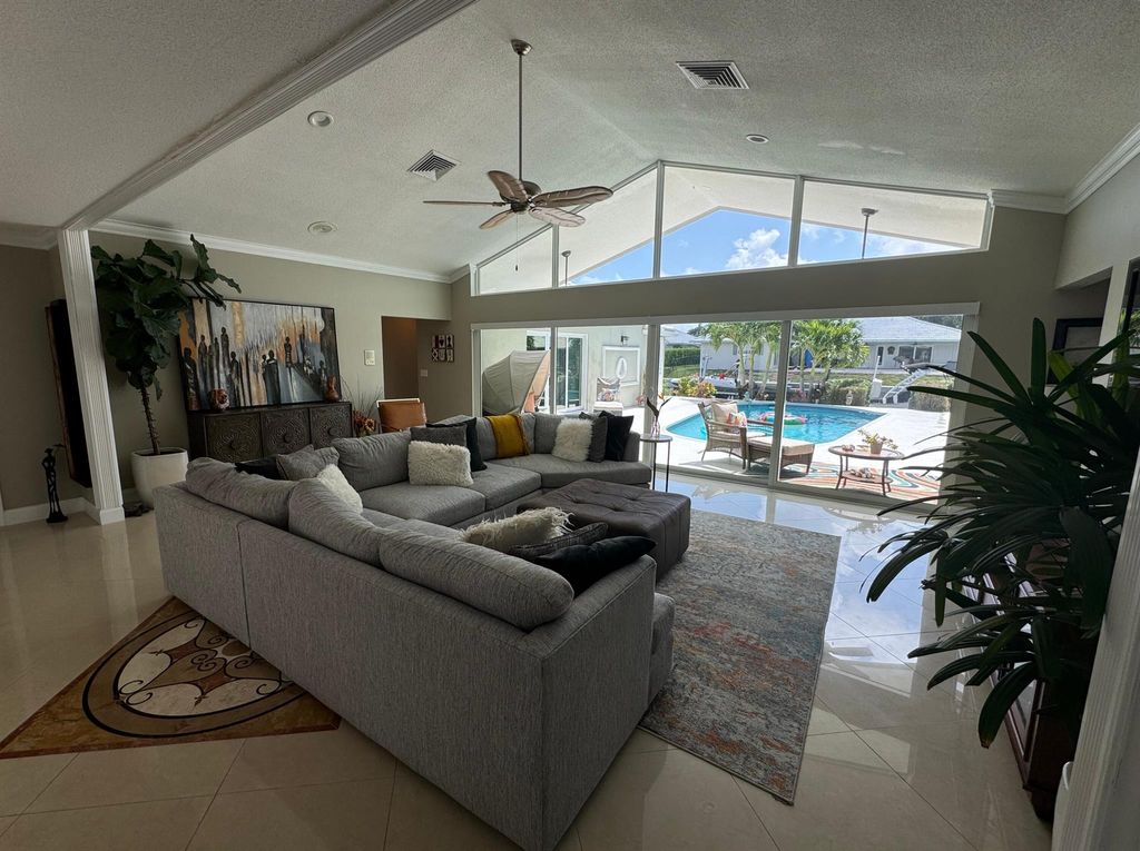 Photo of 1204 SW Tamarind Way, Boca Raton, FL 33486 (MLS # R11006973)