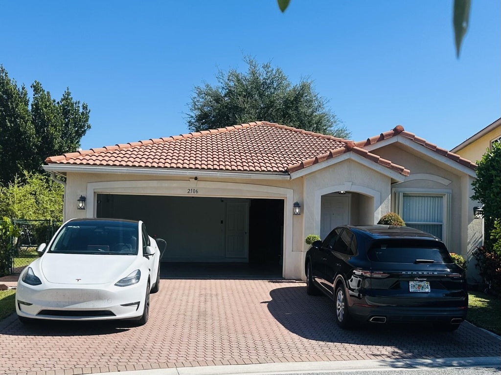 Photo of 2106 Little Torch Street, Riviera Beach, FL 33407 (MLS # B26081065)