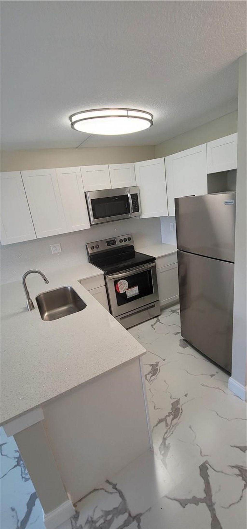 Photo of 2771 Riverside Drive #416-a, Coral Springs, FL 33065 (MLS # B26003714)