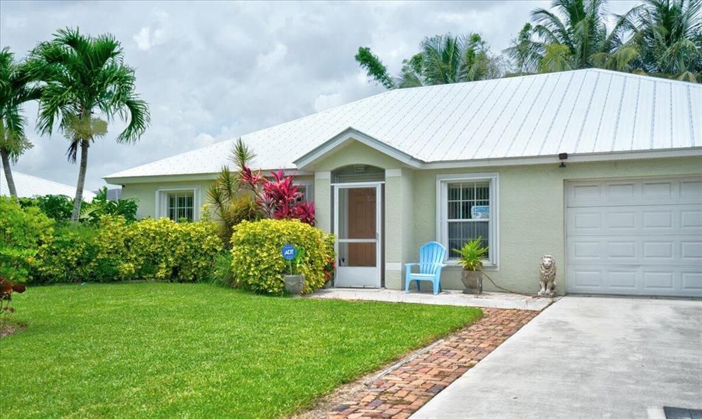 Photo of 279 SW Glenwood Drive, Port Saint Lucie, FL 34984 (MLS # R10810387)