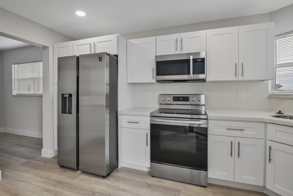 Photo of 3590 Via Poinciana #501, Lake Worth, FL 33467 (MLS # B26042295)