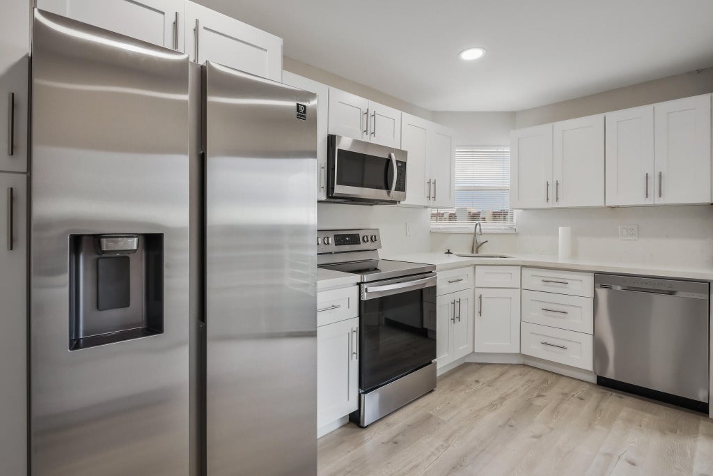 Photo of 3590 Via Poinciana #501, Lake Worth, FL 33467 (MLS # B26042295)